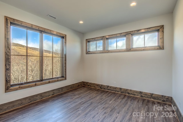 empty room featuring hardwood / wood-style flooring