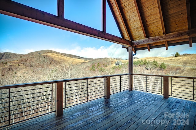 wooden terrace featuring a mountain view