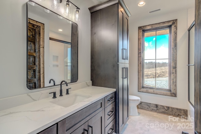 full bathroom featuring recessed lighting, visible vents, vanity, and toilet