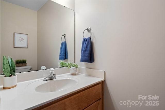 bathroom with vanity and toilet