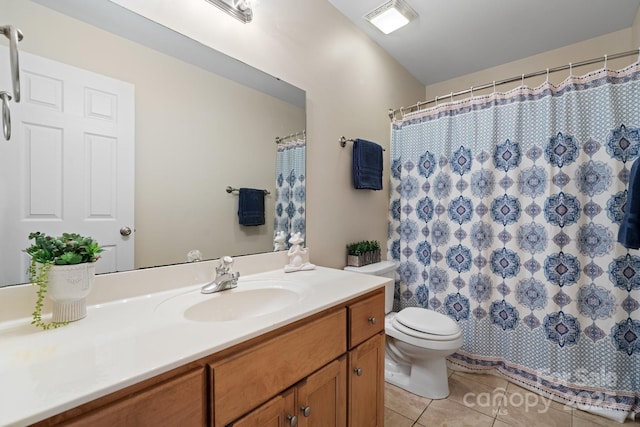 bathroom featuring visible vents, curtained shower, toilet, tile patterned floors, and vanity