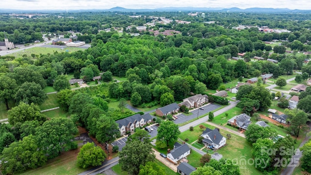 birds eye view of property featuring a mountain view and a residential view