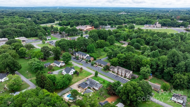 drone / aerial view featuring a forest view