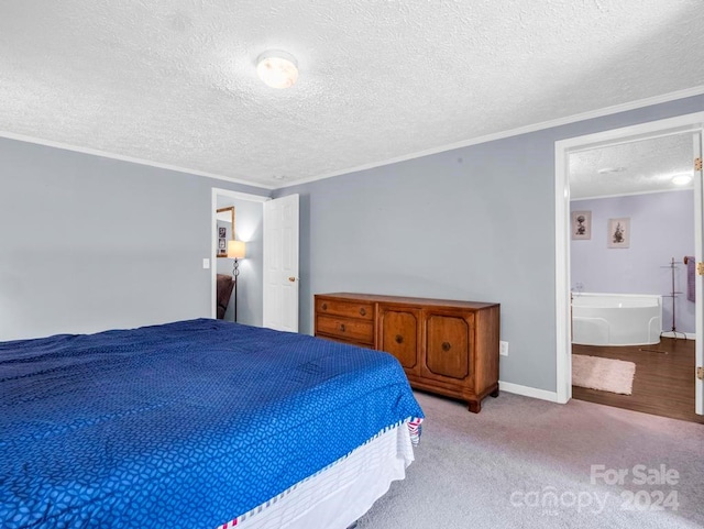 bedroom with hardwood / wood-style flooring, ornamental molding, a textured ceiling, and ensuite bath