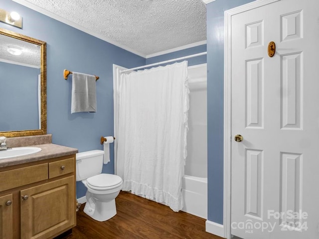 full bathroom with toilet, vanity, shower / bath combo, hardwood / wood-style flooring, and a textured ceiling