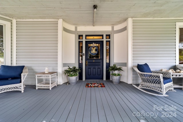 entrance to property featuring a porch