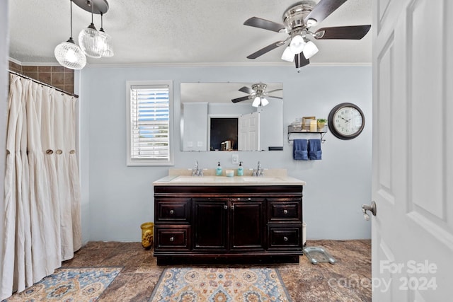 bathroom featuring crown molding, vanity, a textured ceiling, and a shower with curtain