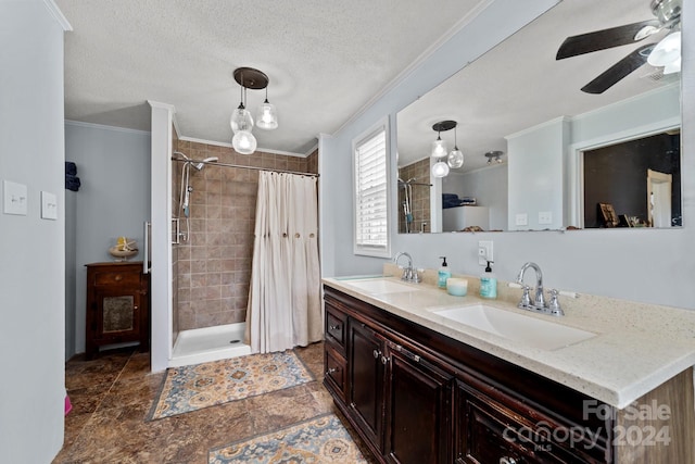 bathroom featuring crown molding, a textured ceiling, vanity, curtained shower, and ceiling fan