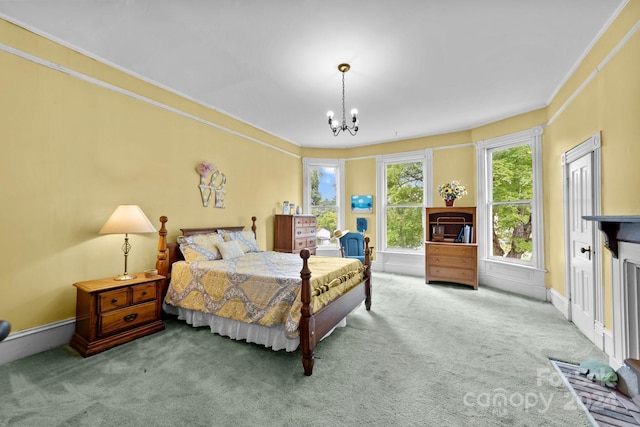 carpeted bedroom featuring a chandelier