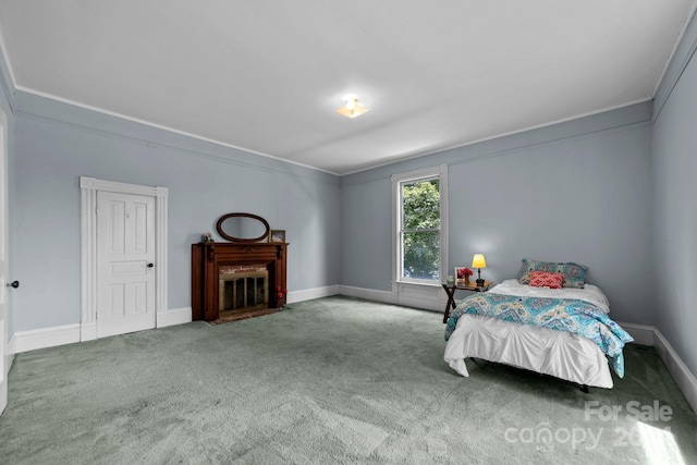 carpeted bedroom featuring ornamental molding