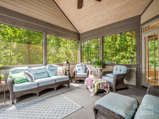 sunroom with wooden ceiling, vaulted ceiling, and ceiling fan