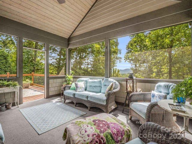 sunroom / solarium featuring wood ceiling and vaulted ceiling