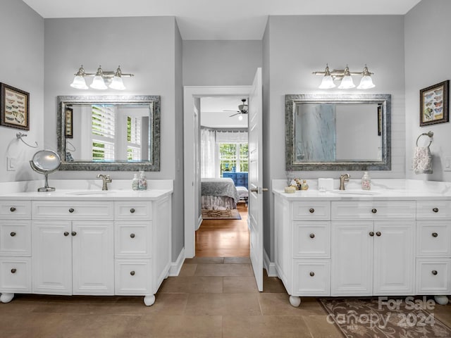 bathroom with vanity, ceiling fan, and hardwood / wood-style flooring