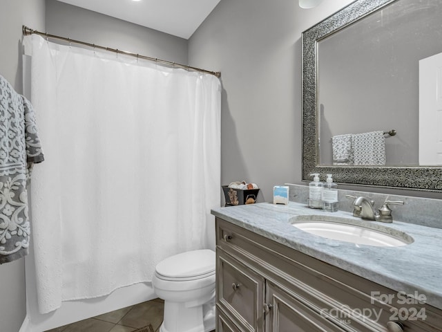 full bathroom featuring vanity, toilet, shower / tub combo, and tile patterned floors