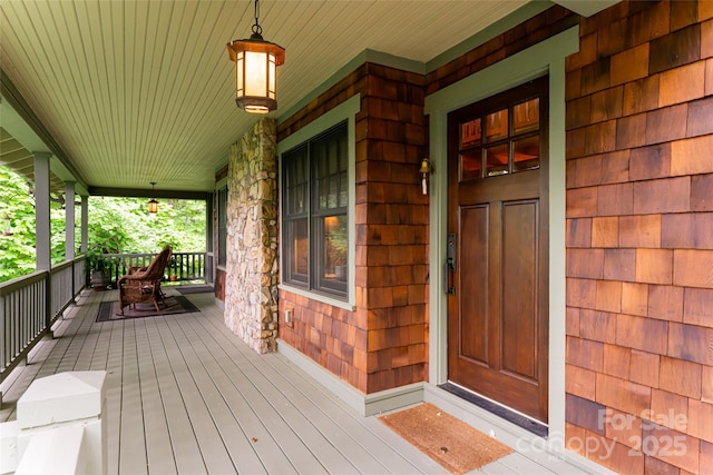 doorway to property with covered porch