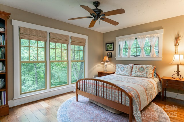 bedroom featuring a ceiling fan and hardwood / wood-style flooring