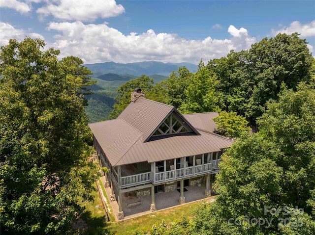 birds eye view of property featuring a mountain view