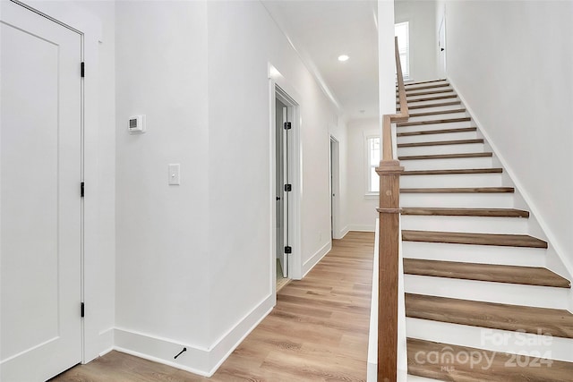 stairway featuring hardwood / wood-style floors