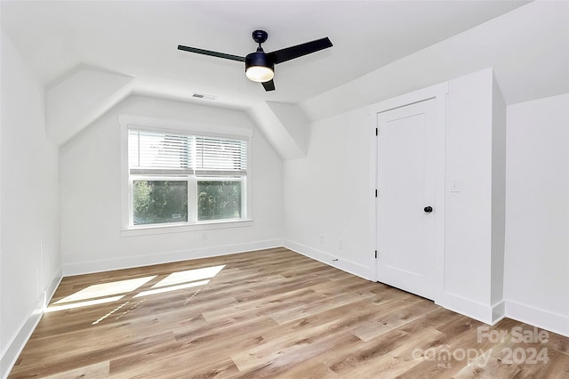 additional living space featuring ceiling fan, light hardwood / wood-style flooring, and lofted ceiling