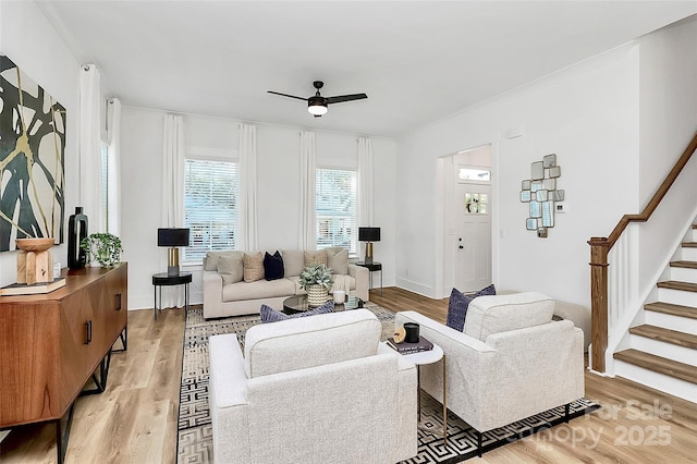 3230 Rogers St, Charlotte, NC 28208 - living room featuring light wood-style floors, stairway, and ceiling fan