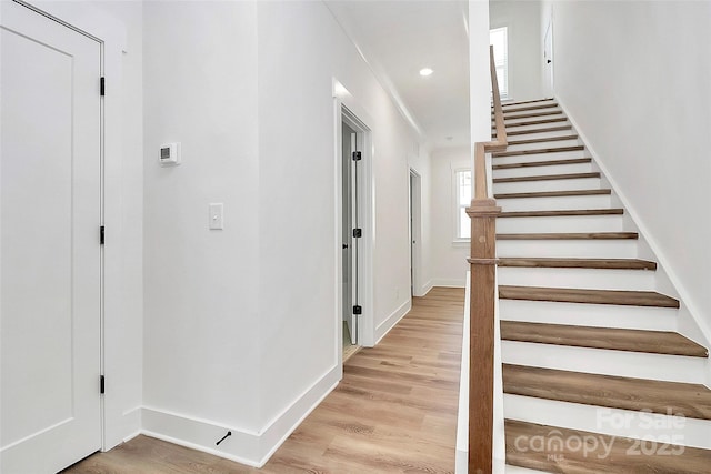 3230 Rogers St, Charlotte, NC 28208 - stairway featuring baseboards, wood finished floors, and recessed lighting
