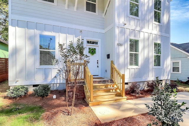 3230 Rogers St, Charlotte, NC 28208 - view of exterior entry featuring board and batten siding and crawl space