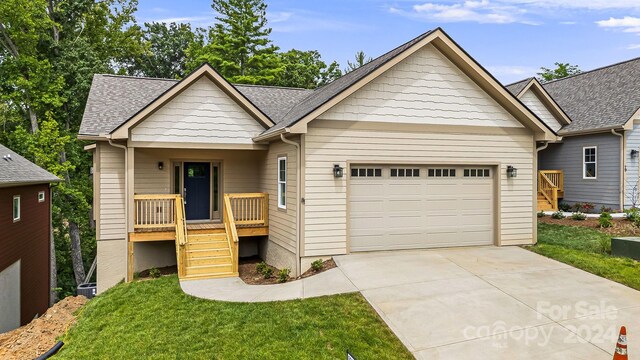 view of front facade featuring a front lawn and a garage