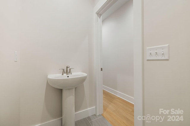 bathroom featuring hardwood / wood-style flooring and sink