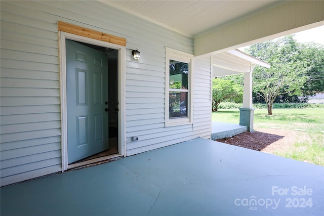 property entrance with a patio area