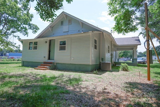 back of house featuring central AC unit