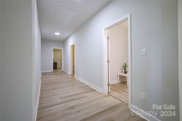 hall with light wood-type flooring