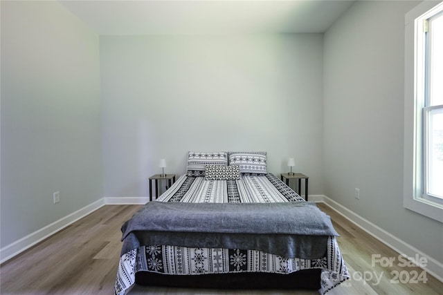 bedroom featuring hardwood / wood-style floors