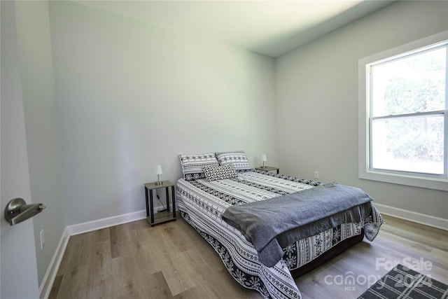 bedroom with light hardwood / wood-style flooring