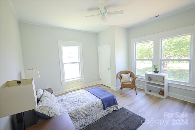 bedroom with ceiling fan and light wood-type flooring