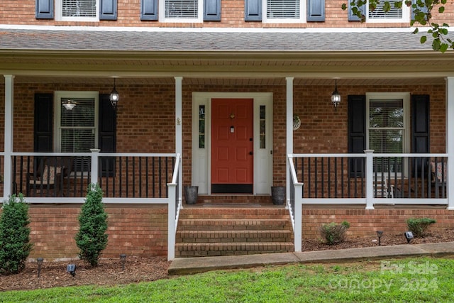 doorway to property featuring covered porch