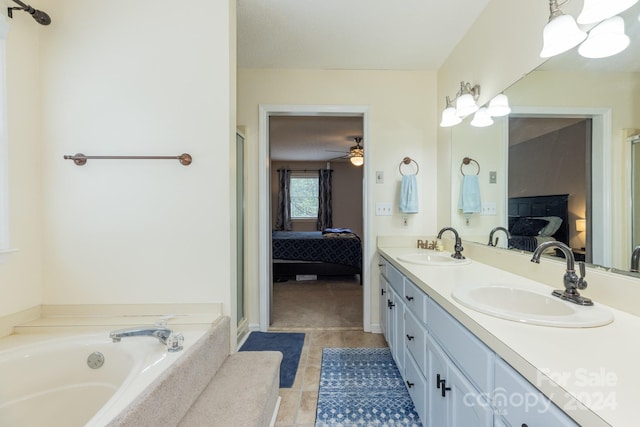 bathroom with vanity, a washtub, tile patterned floors, and a textured ceiling