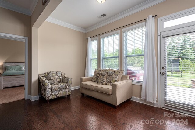 interior space featuring dark hardwood / wood-style floors and crown molding