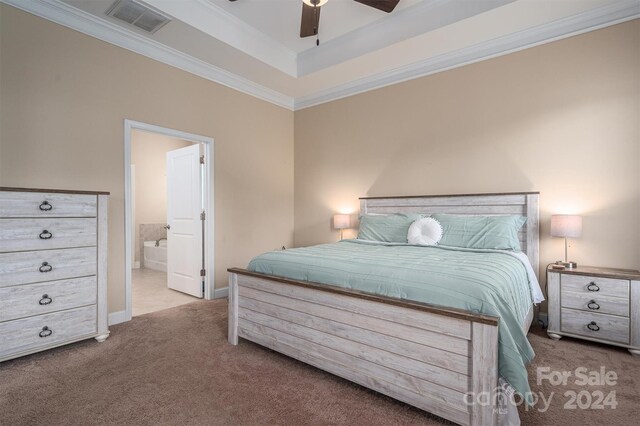 bedroom featuring crown molding, ceiling fan, connected bathroom, and light colored carpet