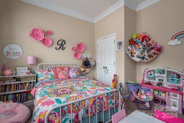 carpeted bedroom featuring crown molding