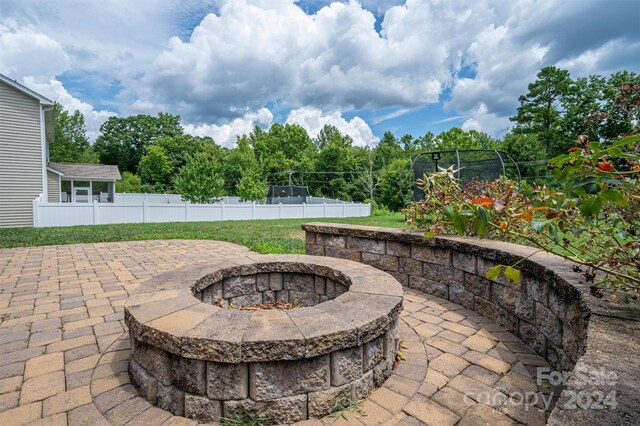 view of patio / terrace featuring an outdoor fire pit