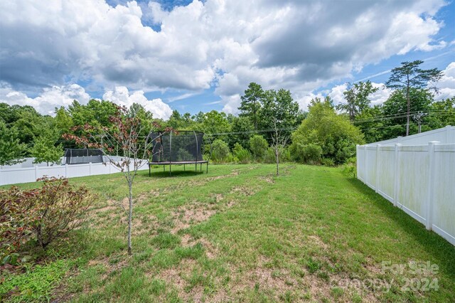 view of yard with a trampoline