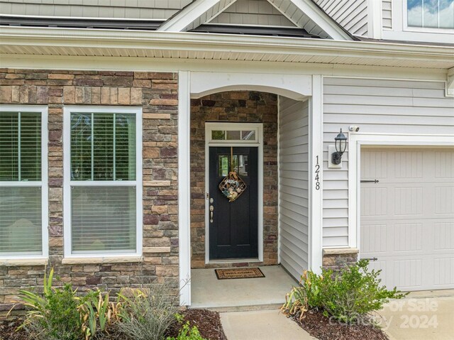 entrance to property featuring a garage