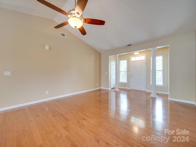 entryway featuring ceiling fan, decorative columns, light hardwood / wood-style flooring, and high vaulted ceiling