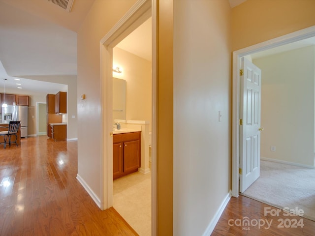 corridor featuring light hardwood / wood-style flooring