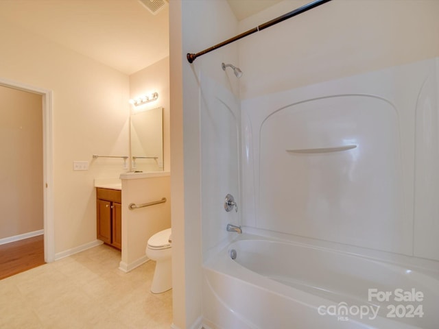 full bathroom featuring hardwood / wood-style flooring, toilet, vanity, and shower / bathtub combination