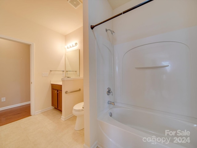 full bathroom with wood-type flooring, bathtub / shower combination, toilet, and vanity