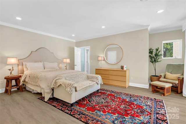 bedroom featuring ornamental molding and hardwood / wood-style floors