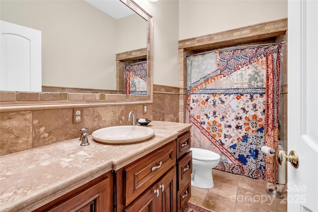 bathroom with toilet, tile walls, a shower with curtain, and vanity