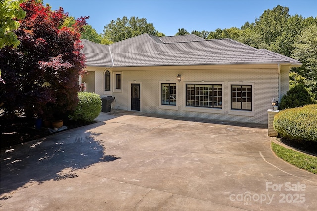 rear view of property featuring a patio