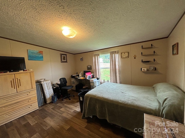 bedroom with crown molding, a textured ceiling, and dark hardwood / wood-style floors